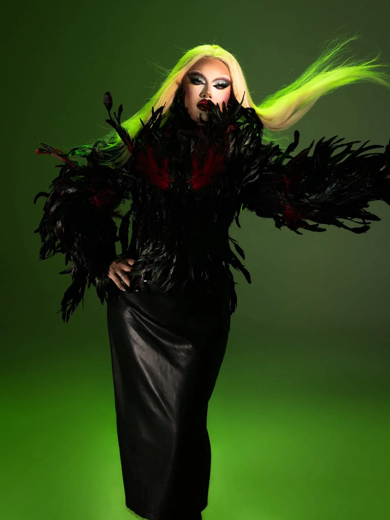 FKA Twink in green feathers